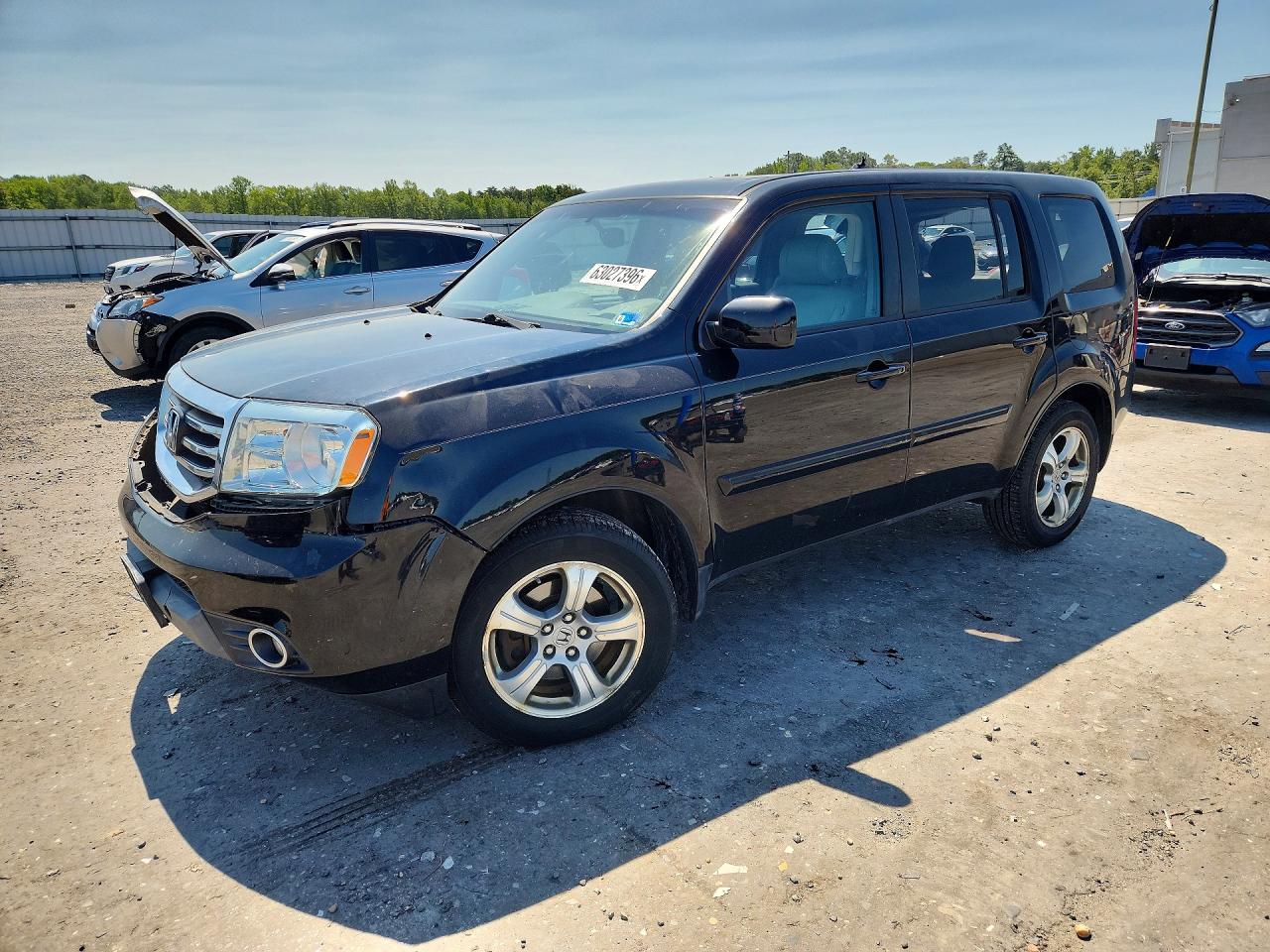 2014 Honda Pilot EX-L, VIN 5FNYF4H51EB016175 — Side