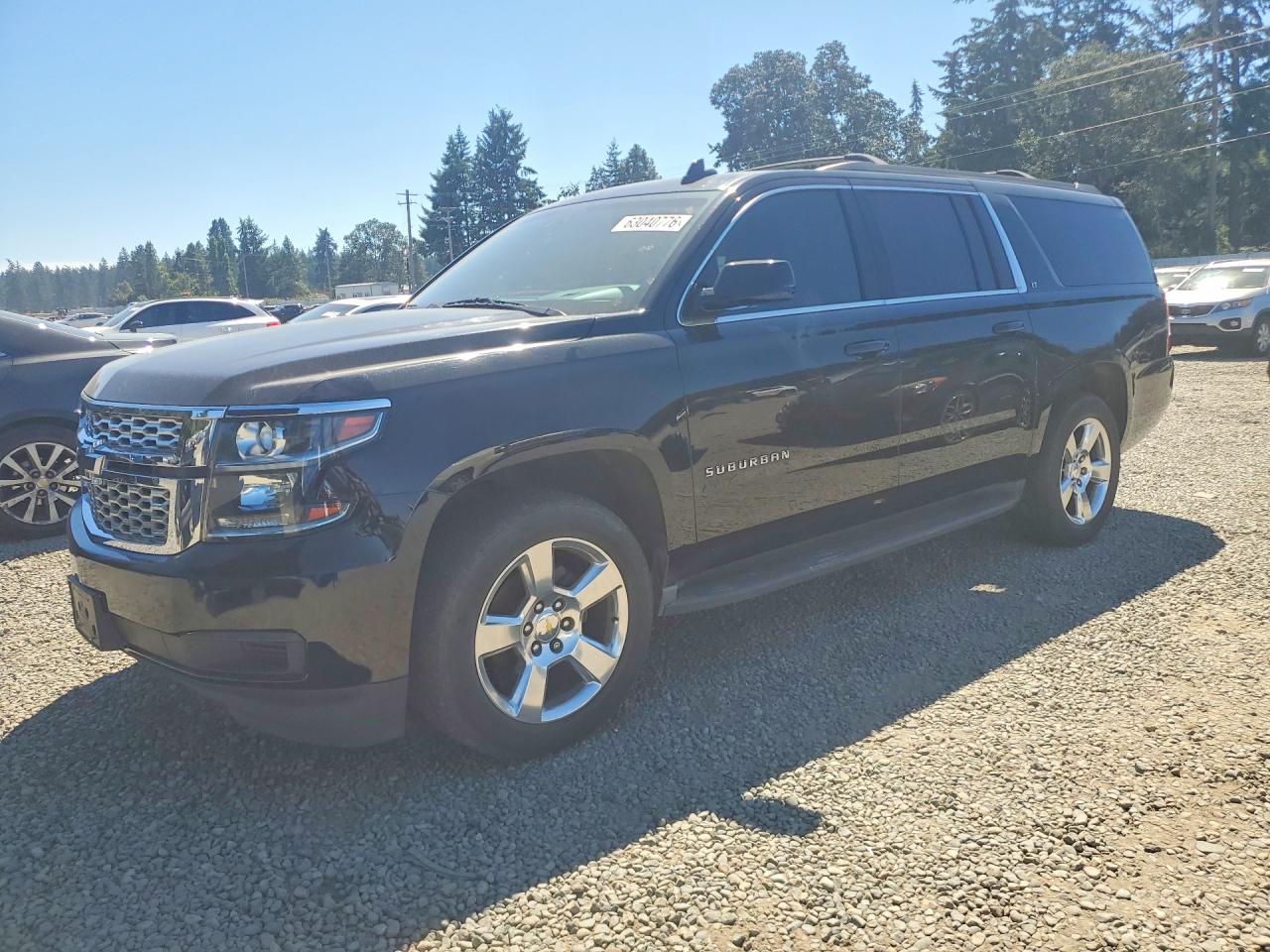 2016 Chevrolet Suburban LT, VIN 1GNSKHKC5GR104327 — Front end