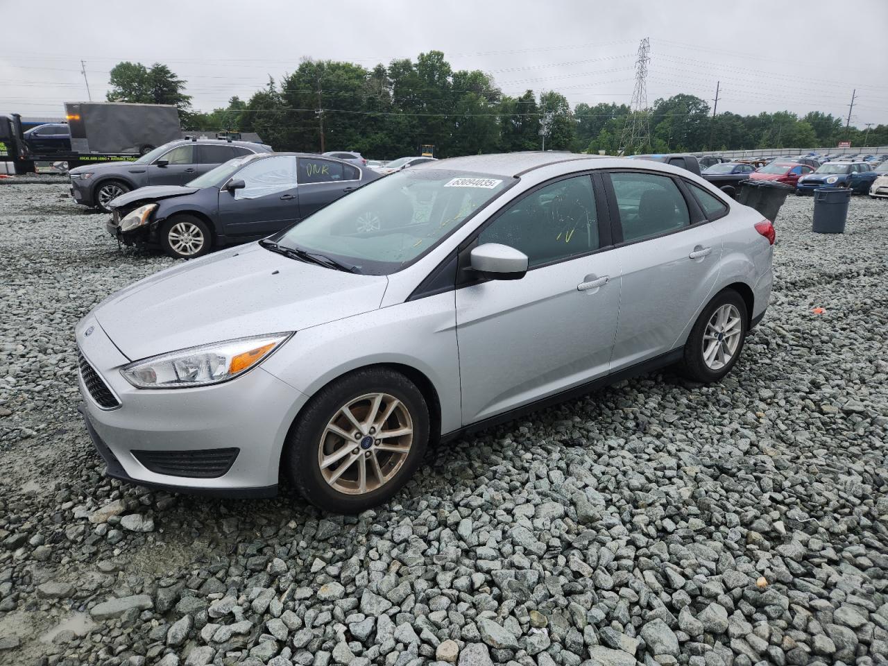 2018 Ford Focus SE, VIN 1FADP3F29JL299209 — Side