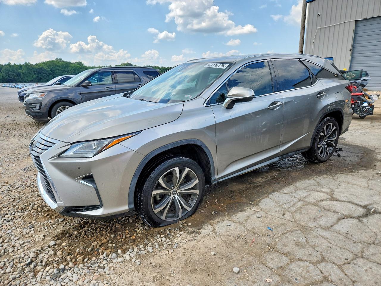 2018 Lexus RX 350L Premium, VIN JTJGZKCA5J2008988 — Side