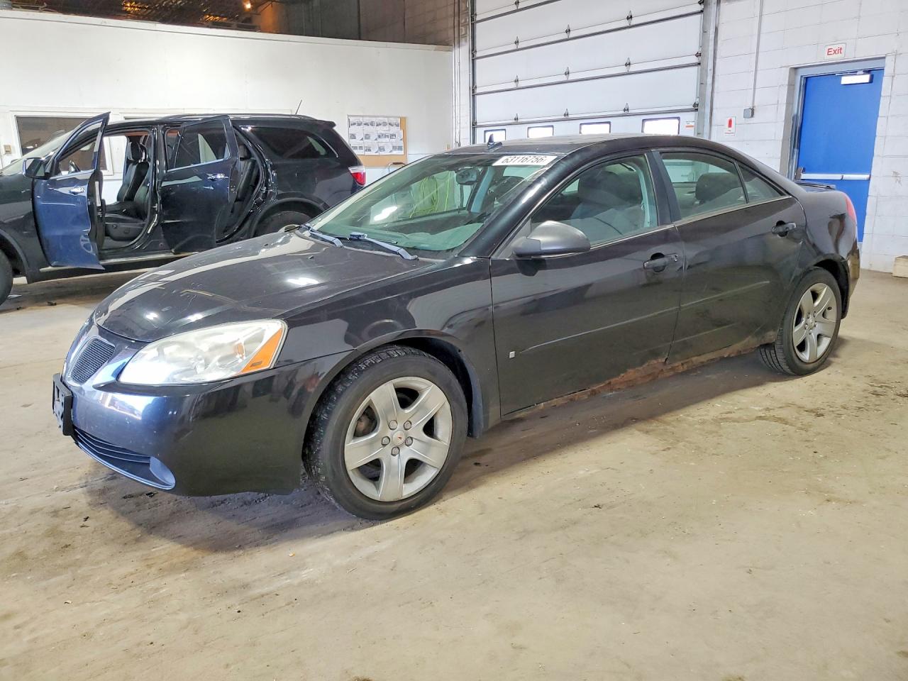 2009 Pontiac G6 1SA, VIN 1G2ZG57B494110468 — Side