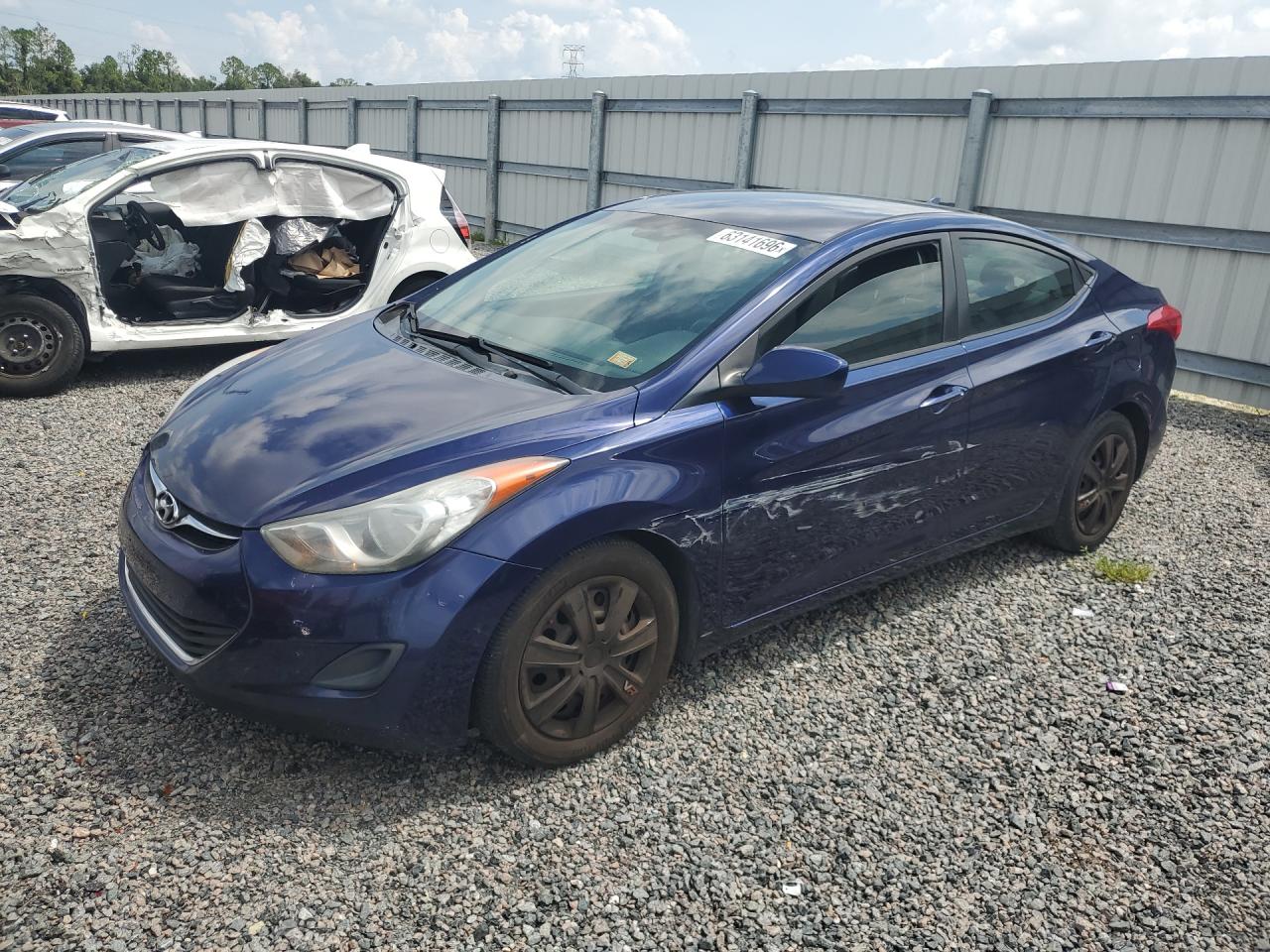 2011 Hyundai Elantra Limited, VIN 5NPDH4AE6BH031450 — Side