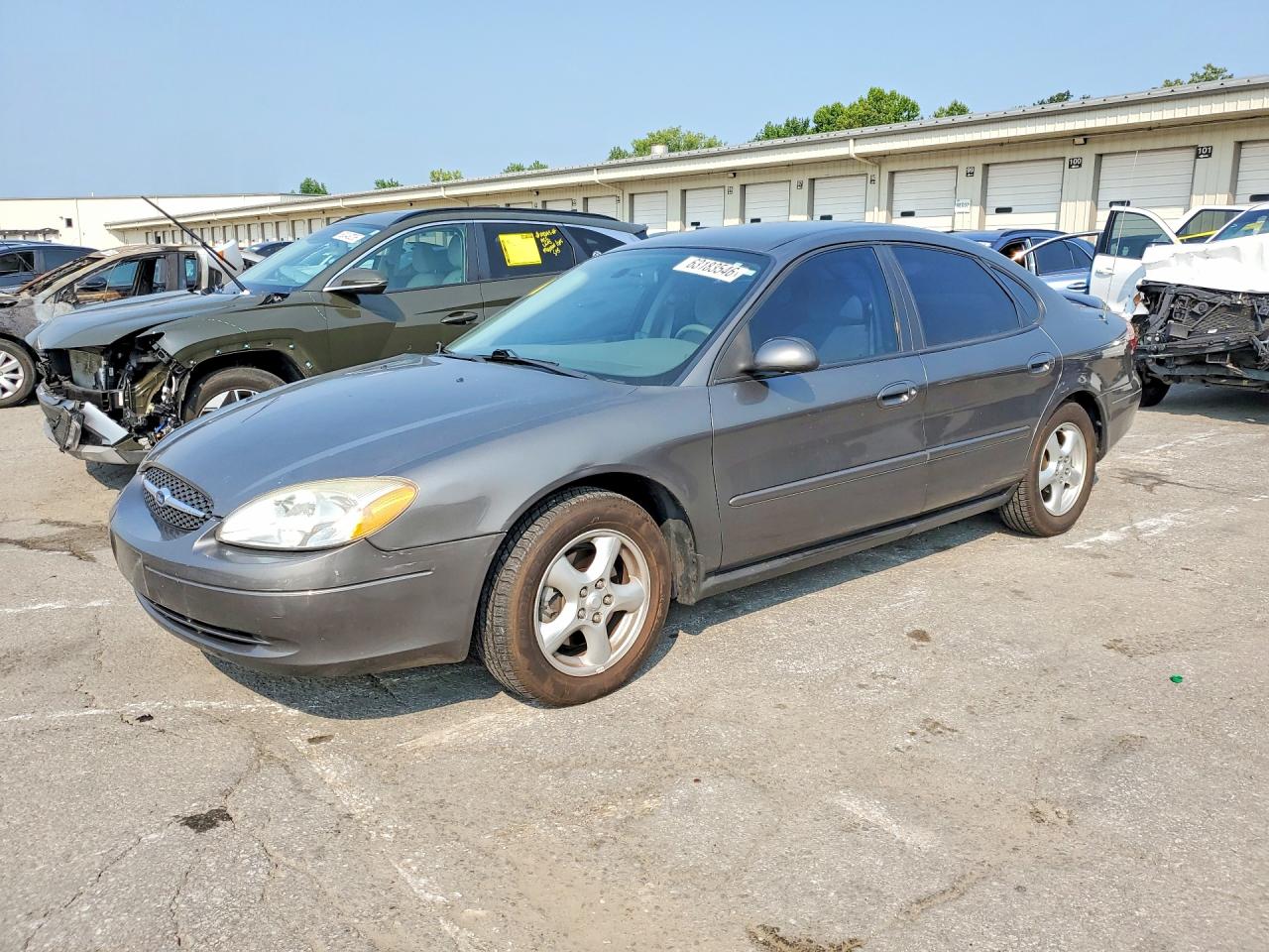 2003 Ford Taurus SE Standard, VIN 1FAFP53U33A244909 — Side
