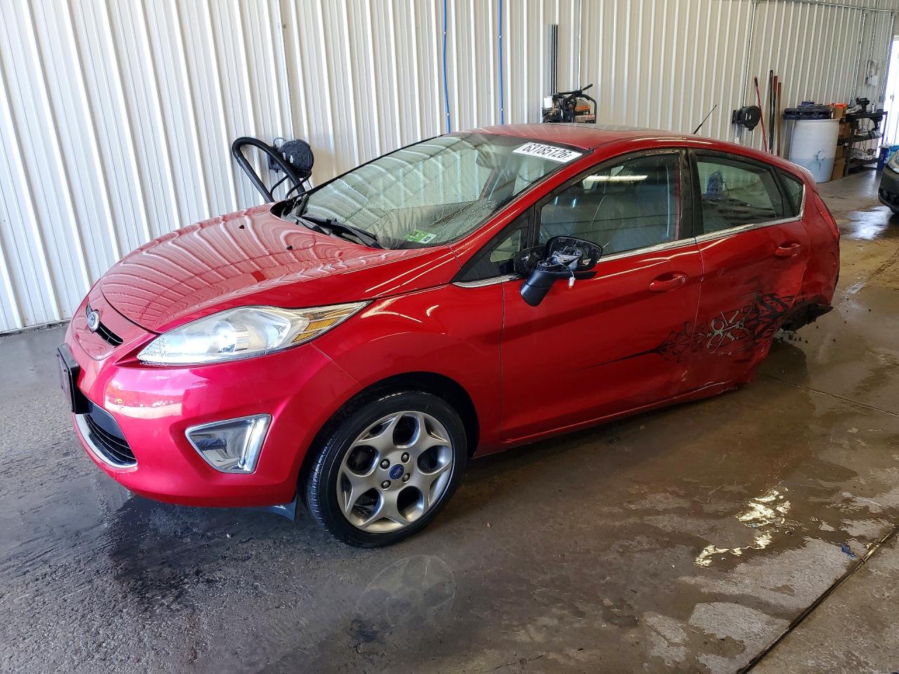2012 Ford Fiesta SES, VIN 3FADP4FJ7CM150294 — Днище