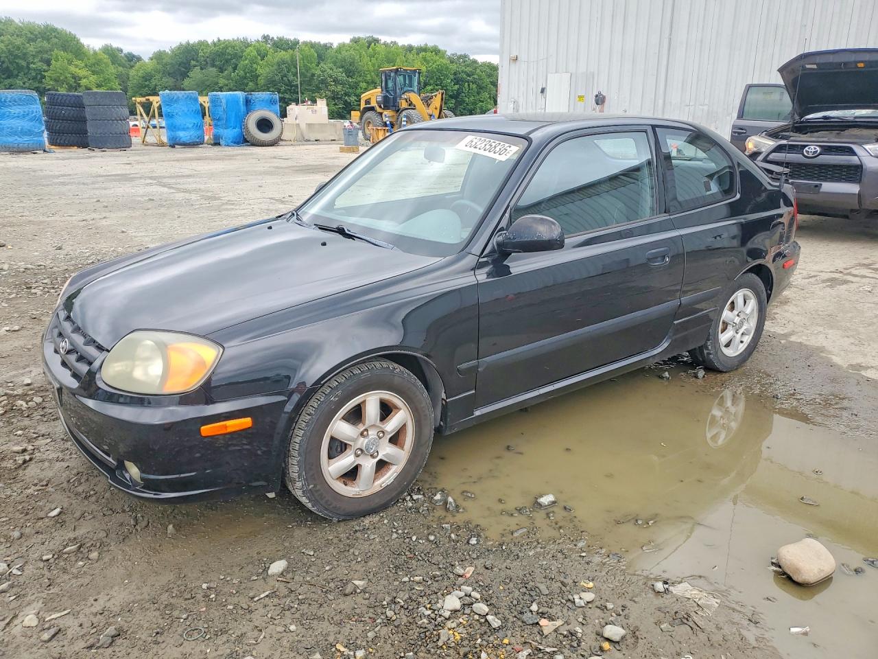 2004 Hyundai Accent GL, VIN KMHCG35C04U303951 — Side