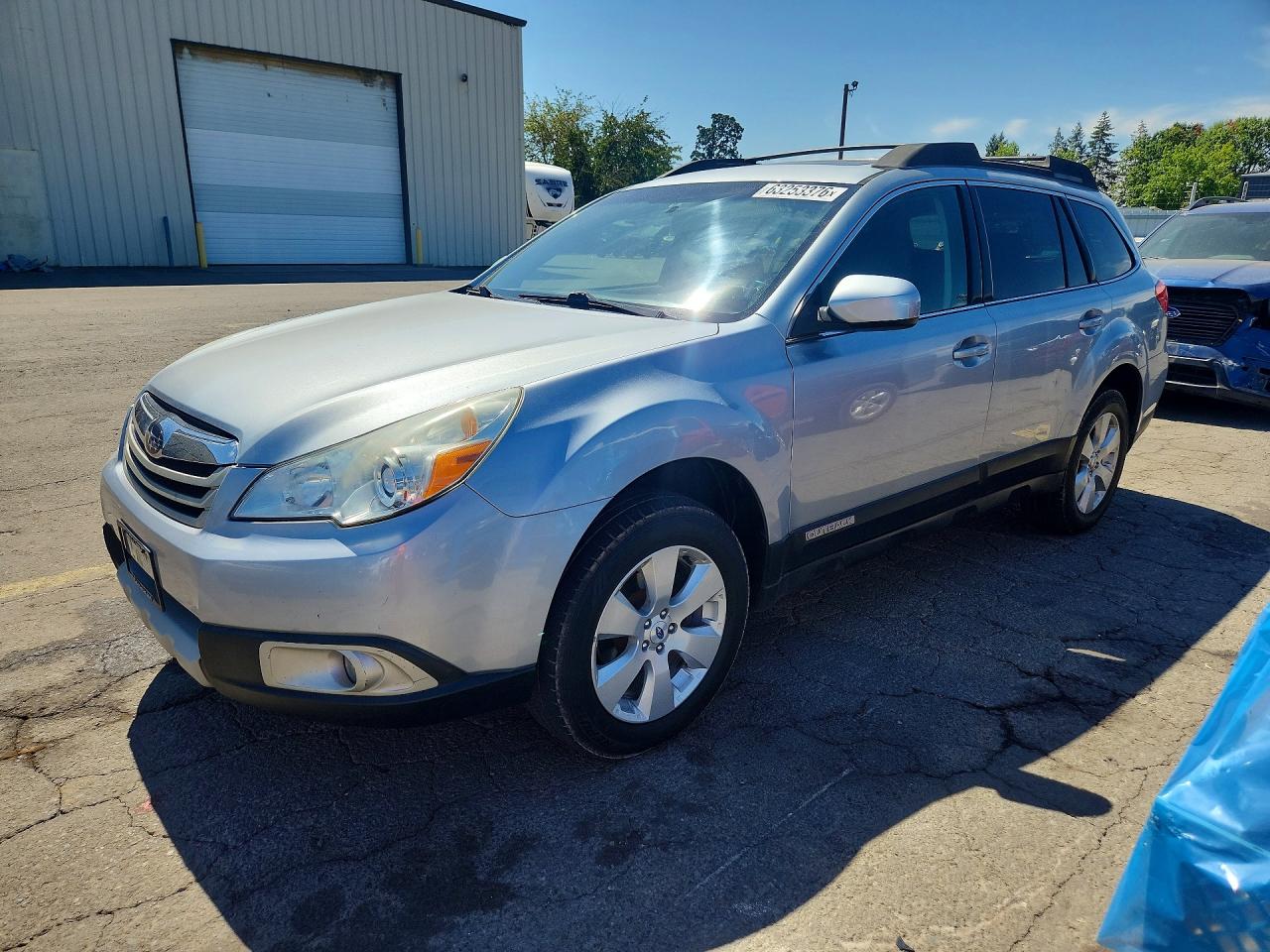 2012 Subaru Outback Limited, VIN 4S4BRBKC4C3200122 — Side
