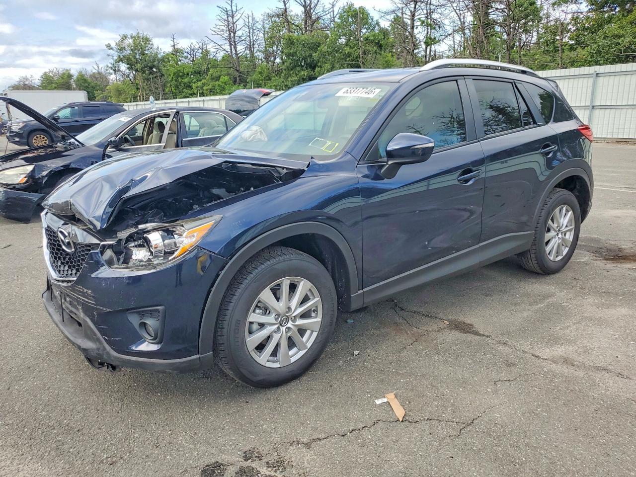 2015 Mazda CX-5 Touring, VIN JM3KE2CY8F0530286 — Front end