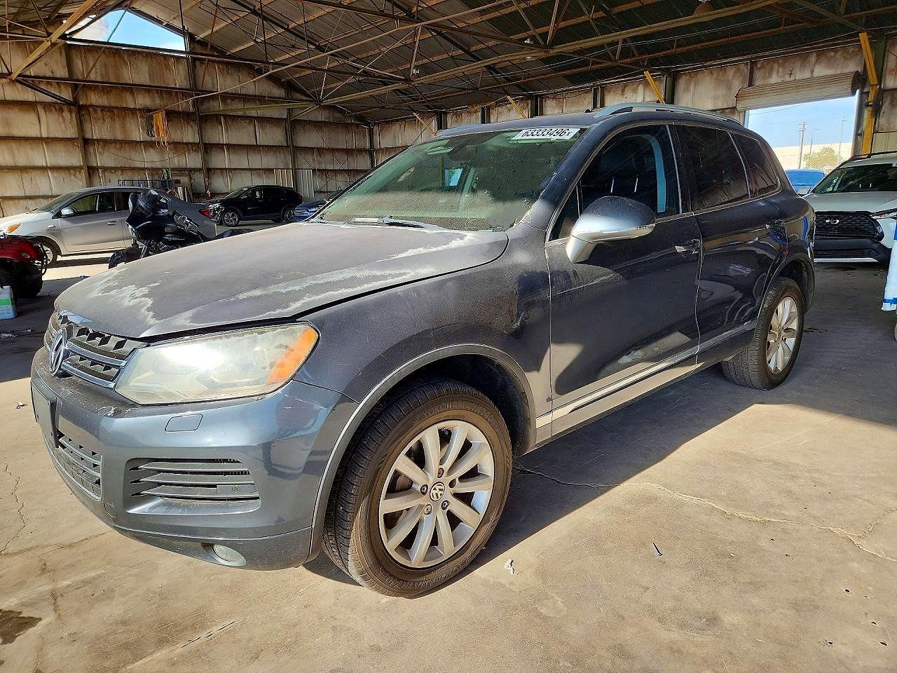 2012 Volkswagen Touareg Sport, VIN WVGFK9BP8CD000100 — Front end