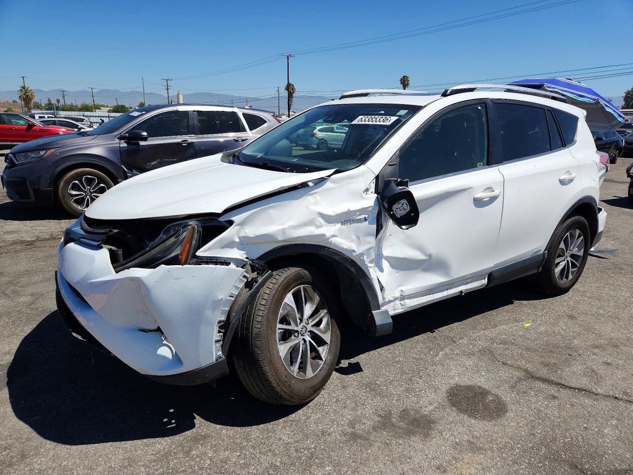 2018 Toyota RAV4 Hybrid XLE, VIN JTMRJREV0JD179860 — Front end