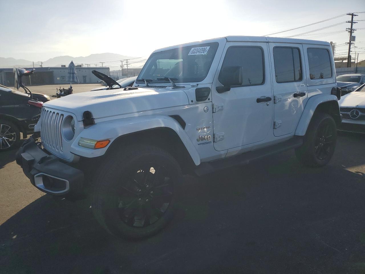 2021 Jeep Wrangler Unlimited Sahara, VIN 1C4JJXP67MW643727 — Front end