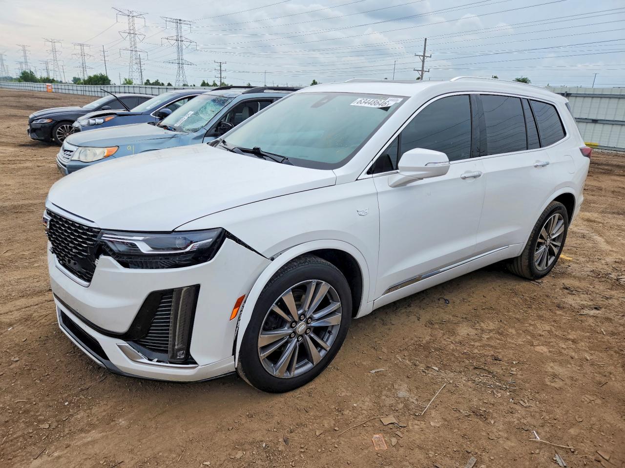 2021 Cadillac XT6 Premium Luxury, VIN 1GYKPCRS6MZ179201 — Мелкие вмятины и царапины