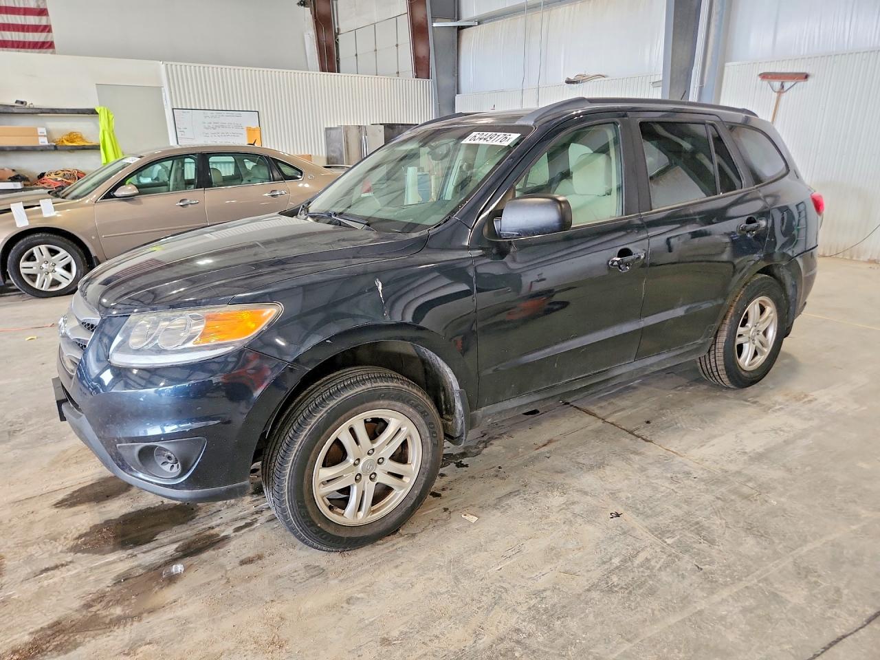 2012 Hyundai Santa Fe GLS, VIN 5XYZG3AB4CG137428 — Rear end