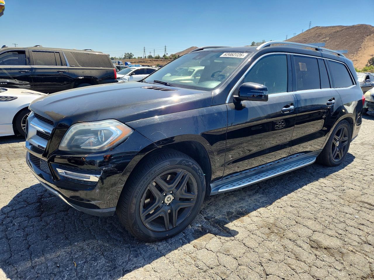 2014 Mercedes-Benz GL 450, VIN 4JGDF7CE4EA302291 — Minor dents and scratches