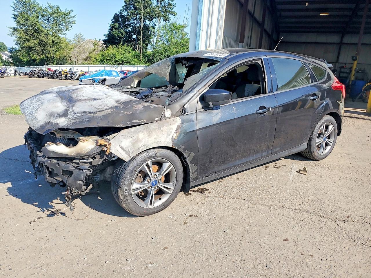 2012 Ford Focus SE, VIN 1FAHP3K23CL306911 — Engine fire
