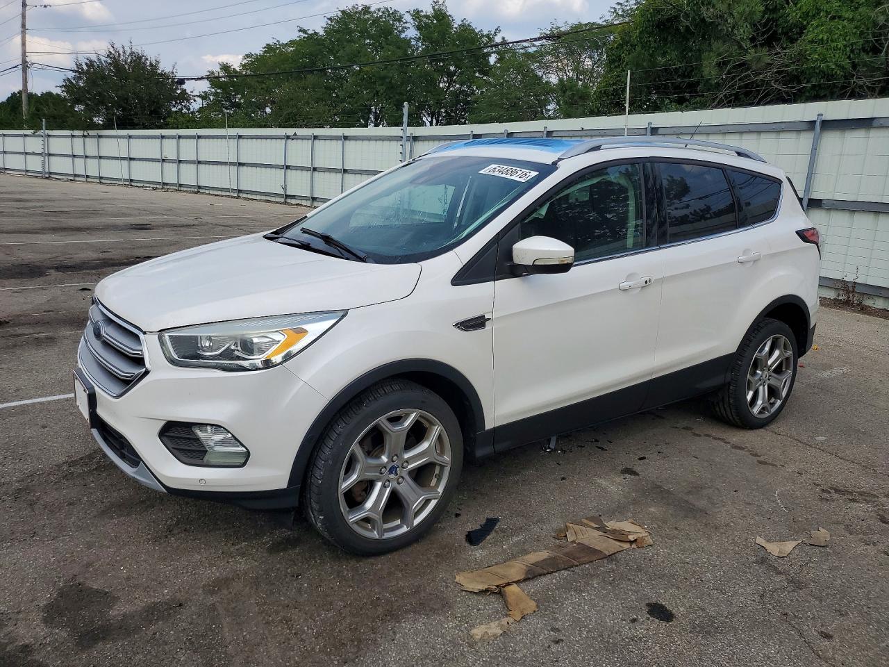 2017 Ford Escape Titanium, VIN 1FMCU9J90HUA00731 — Бок