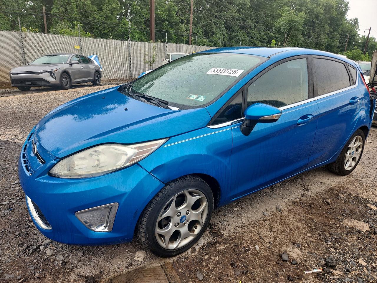 2012 Ford Fiesta SES, VIN 3FADP4FJ8CM117997 — Rear end