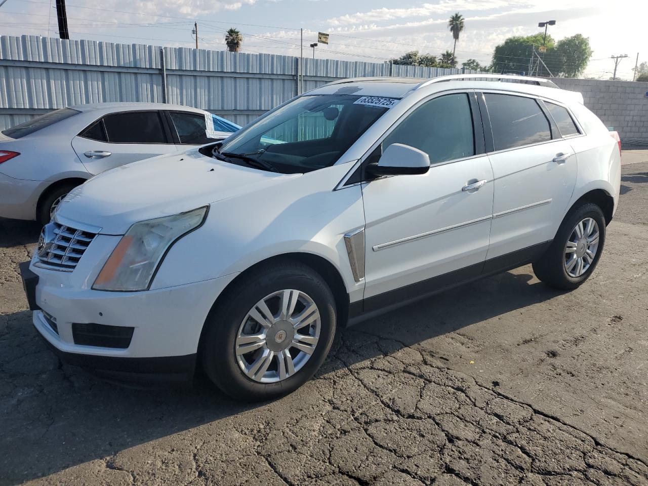 2014 Cadillac SRX Luxury Collection, VIN 3GYFNBE31ES651206 — Фото с аукциона 1 of 13