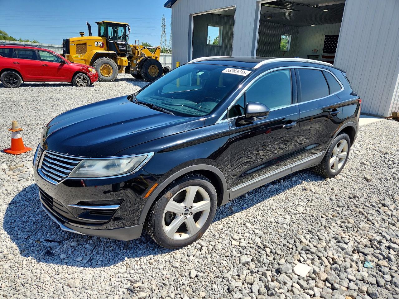 2017 Lincoln MKC Premiere, VIN 5LMCJ1C98HUL12042 — Бок