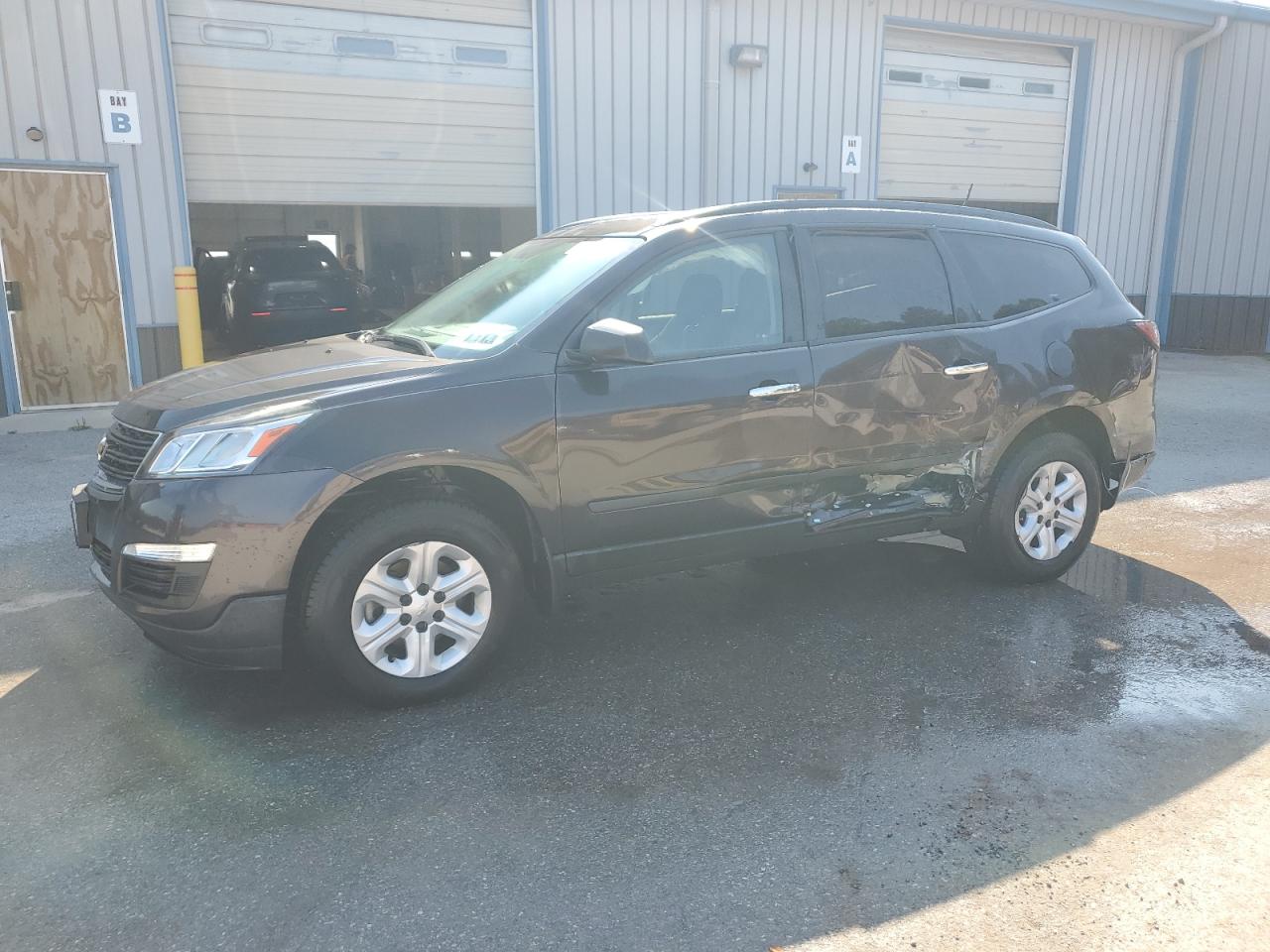 2017 Chevrolet Traverse LS, VIN 1GNKVFED4HJ240285 — Side
