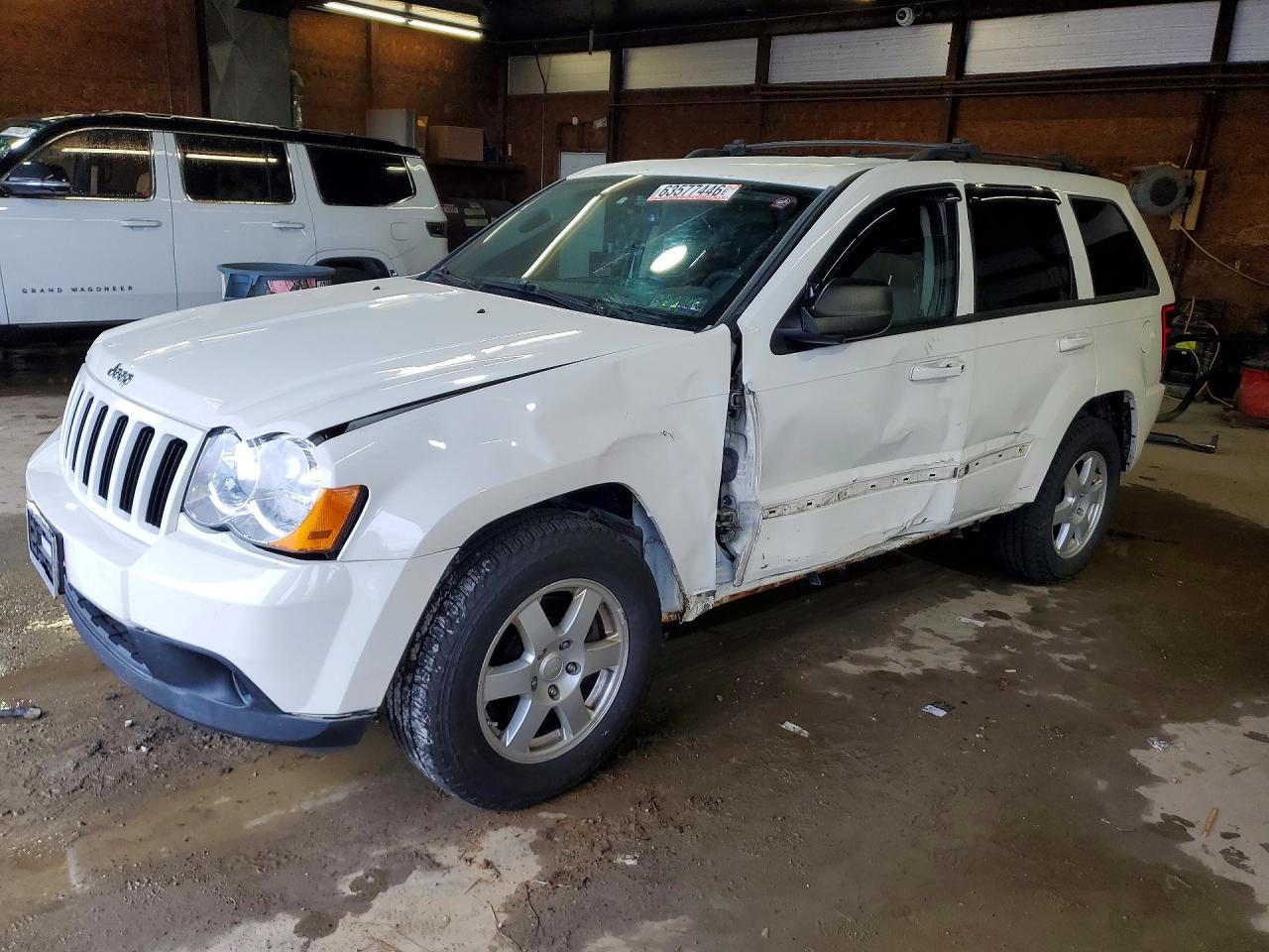 2010 Jeep Grand Cherokee Laredo, VIN 1J4PR4GK3AC111087 — Side