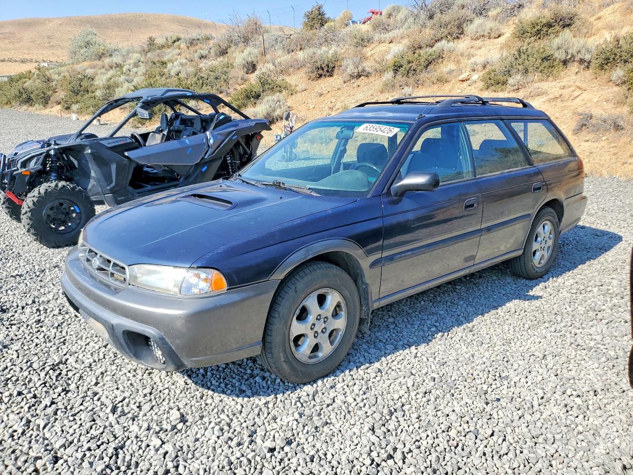 1998 Subaru Legacy Outback, VIN 4S3BG6853W7621479 — Зад