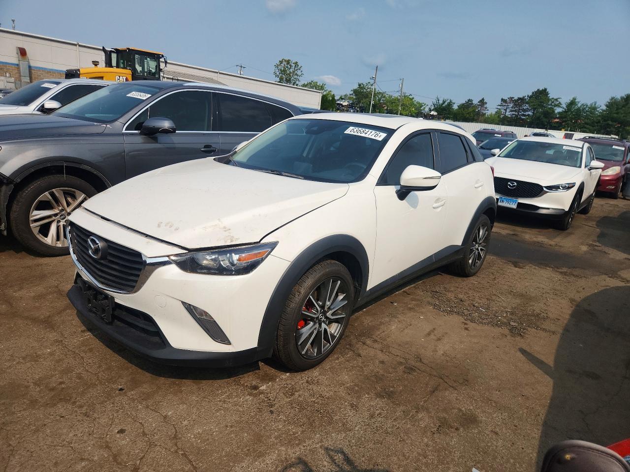 2018 Mazda CX-3 Touring, VIN JM1DKFC78J0311989 — Side