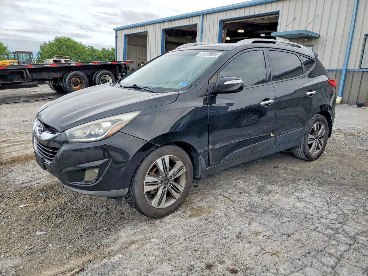 2014 Hyundai Tucson SE, VIN KM8JU3AG9EU793929 — Бок