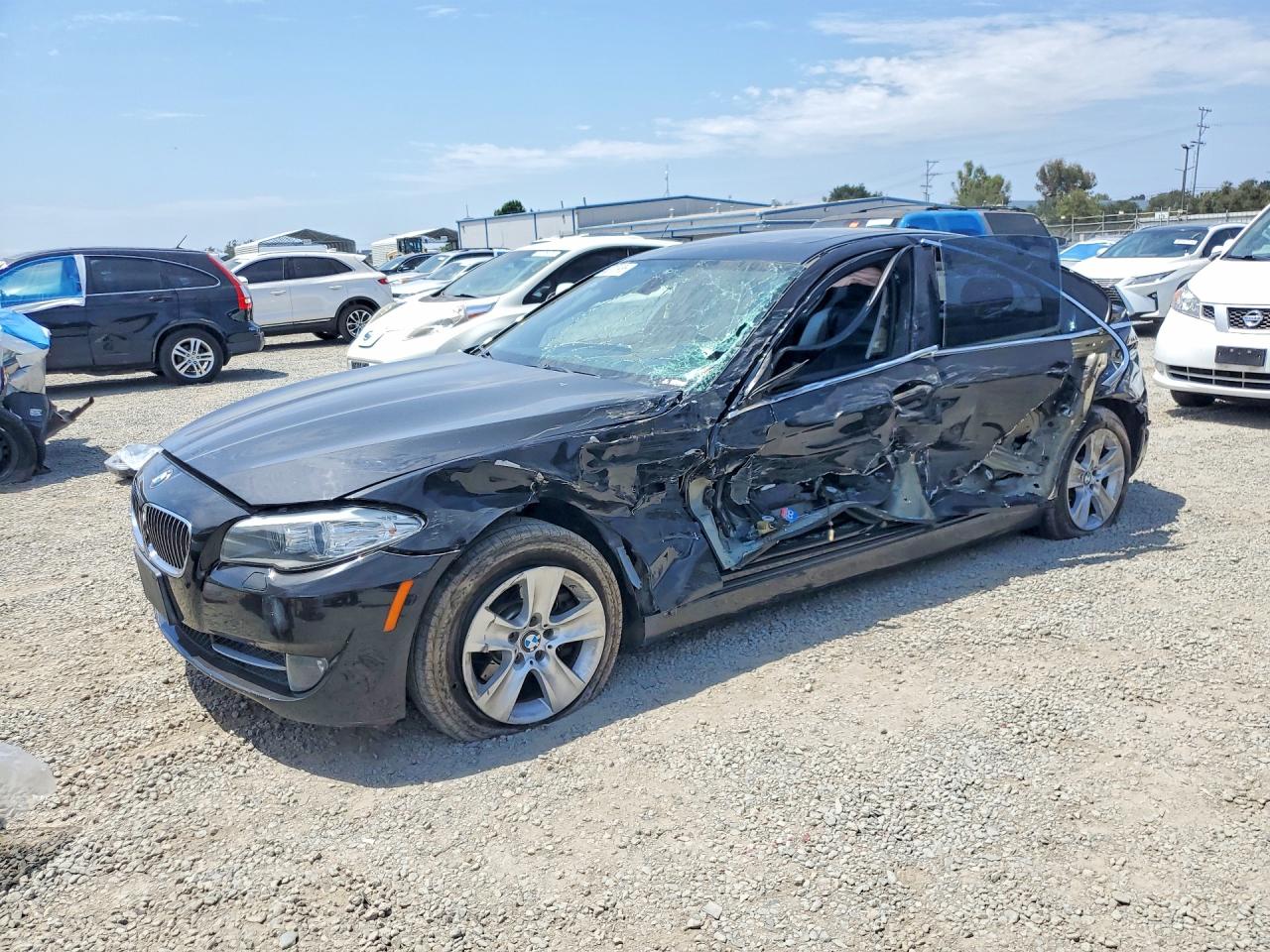 2011 BMW 5 Series 528i, VIN WBAFR1C5XBDS36077 — Side