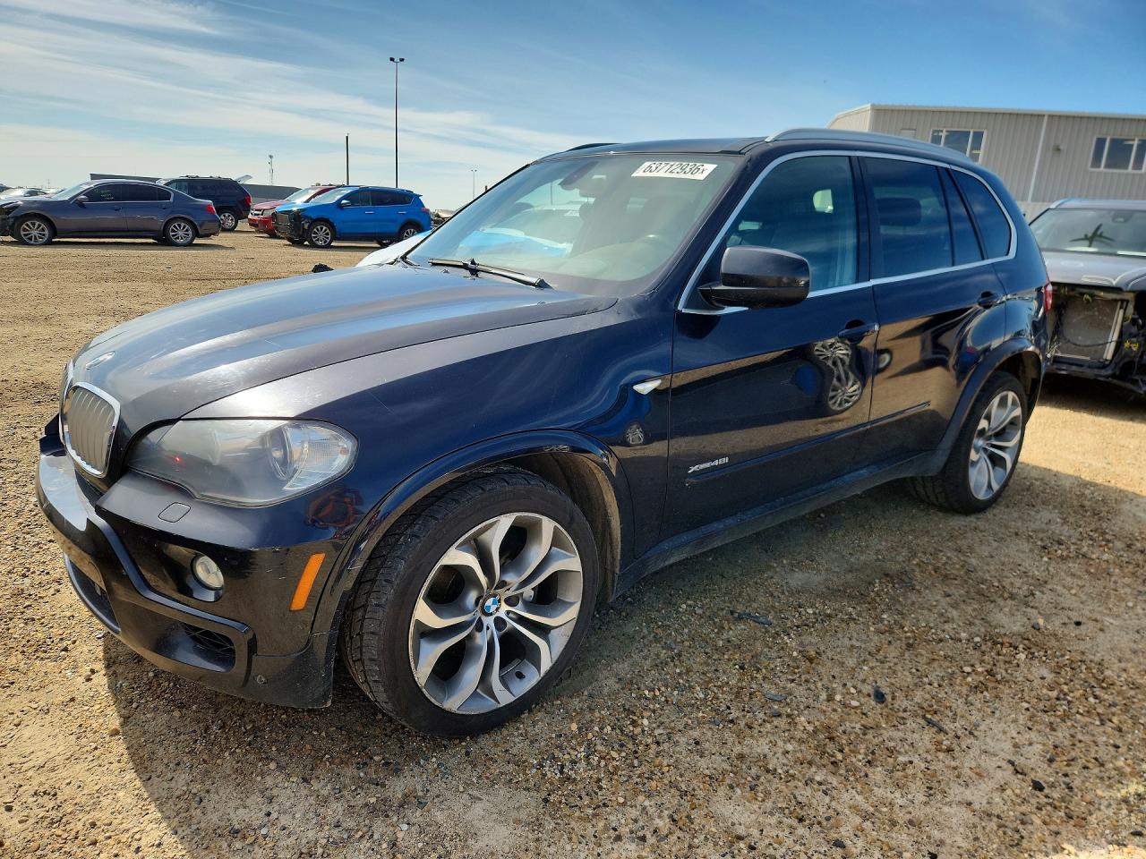 2010 BMW X5 48i, VIN 5UXFE8C52AL311364 — Бок
