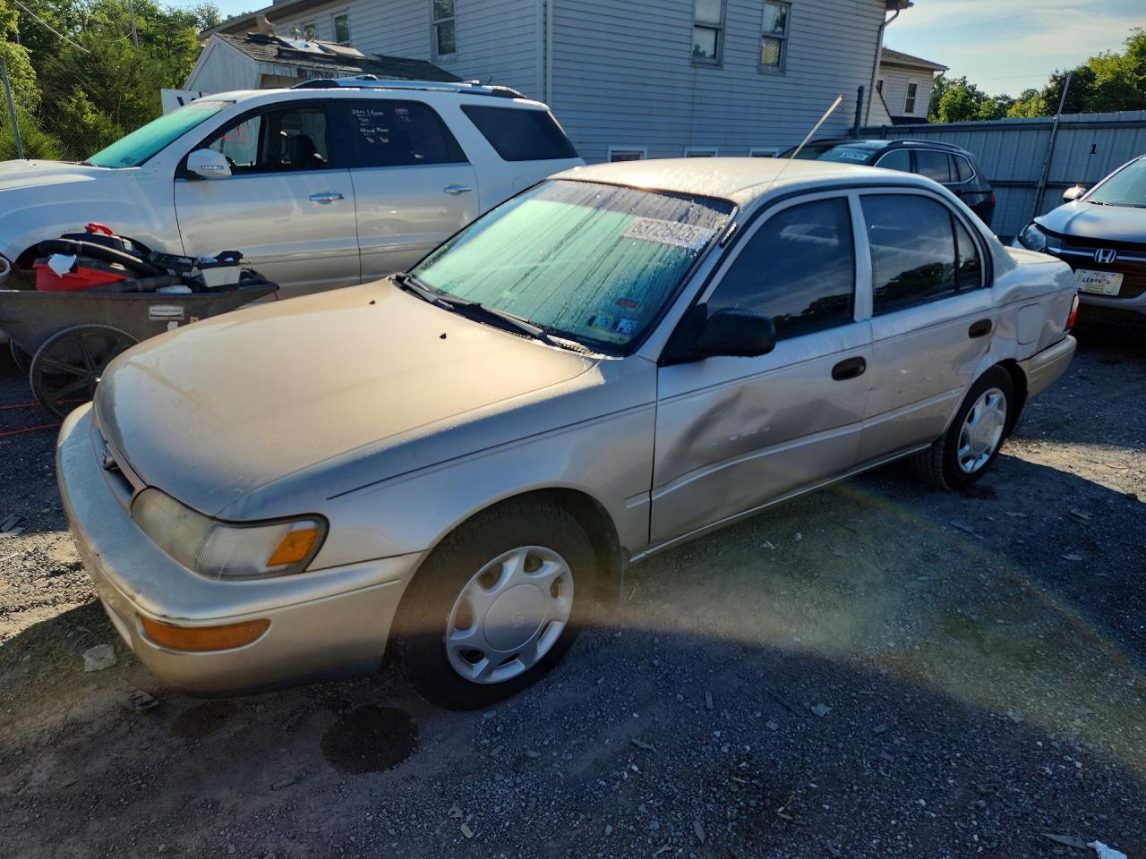 1997 Toyota Corolla CE, VIN 2T1BA02E4VC190042 — Side