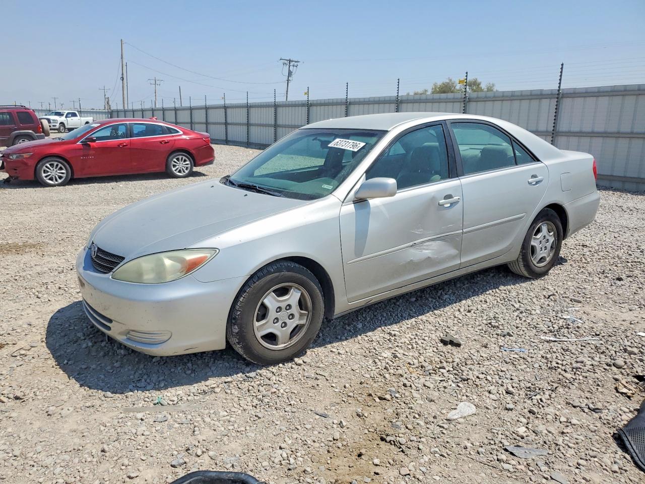 2002 Toyota Camry LE, VIN 4T1BF32K22U020698 — Side