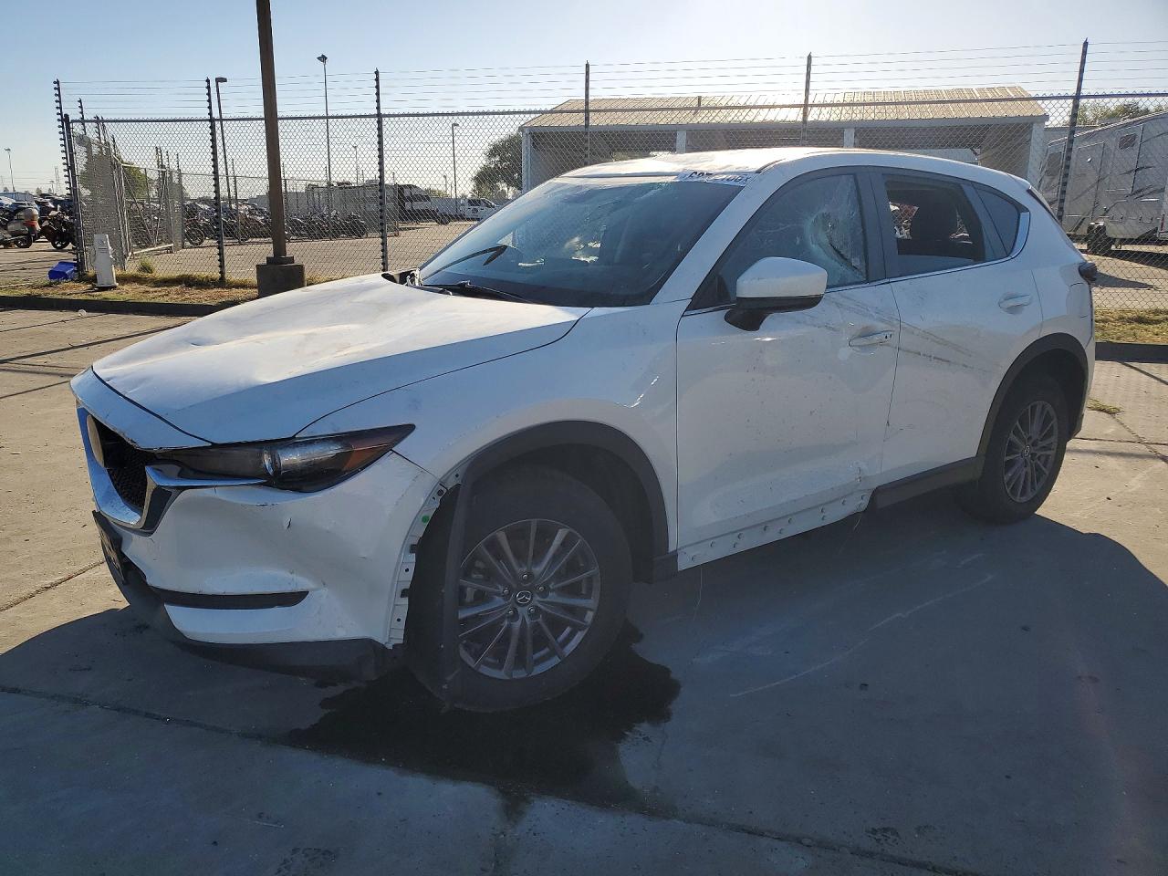 2021 Mazda CX-5 Touring, VIN JM3KFBCM7M1304144 — Water / flood