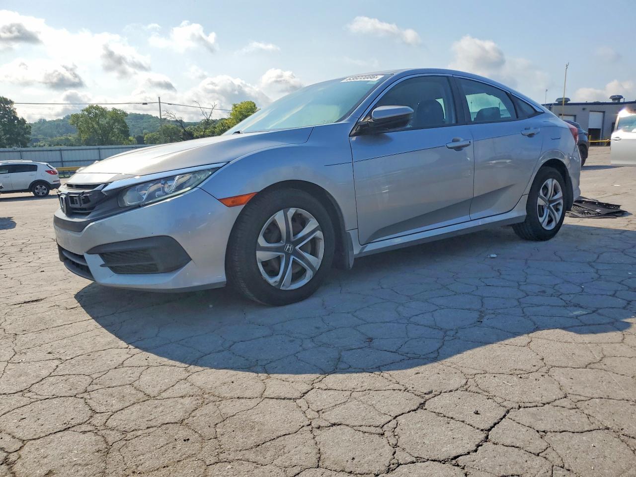 2017 Honda Civic LX, VIN 19XFC2F53HE030435 — Бок