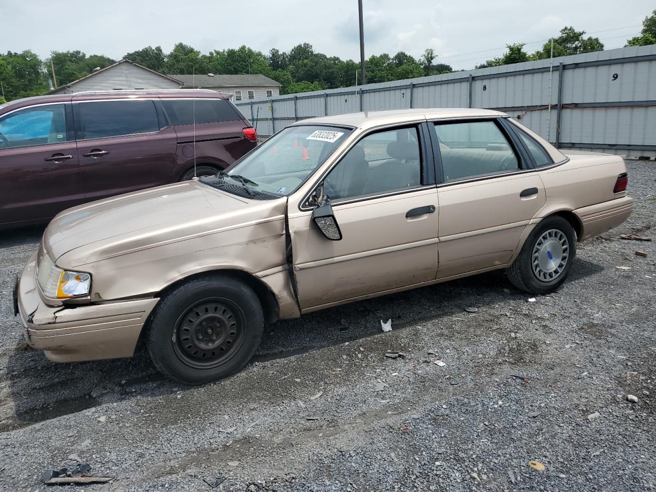 1993 Ford Tempo, VIN 1FACP36X9PK174295 — Side