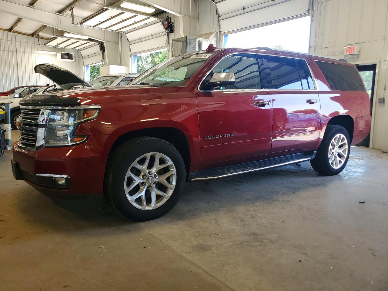 2018 Chevrolet Suburban Premier, VIN 1GNSKJKCXJR391467 — Side