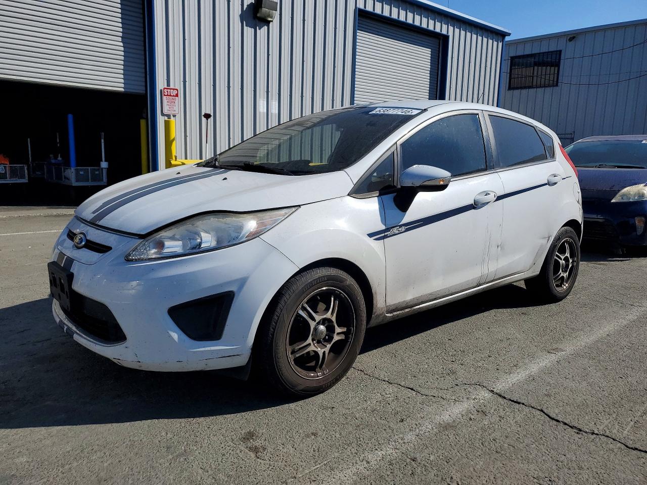 2013 Ford Fiesta SE, VIN 3FADP4EJ9DM208375 — Minor dents and scratches