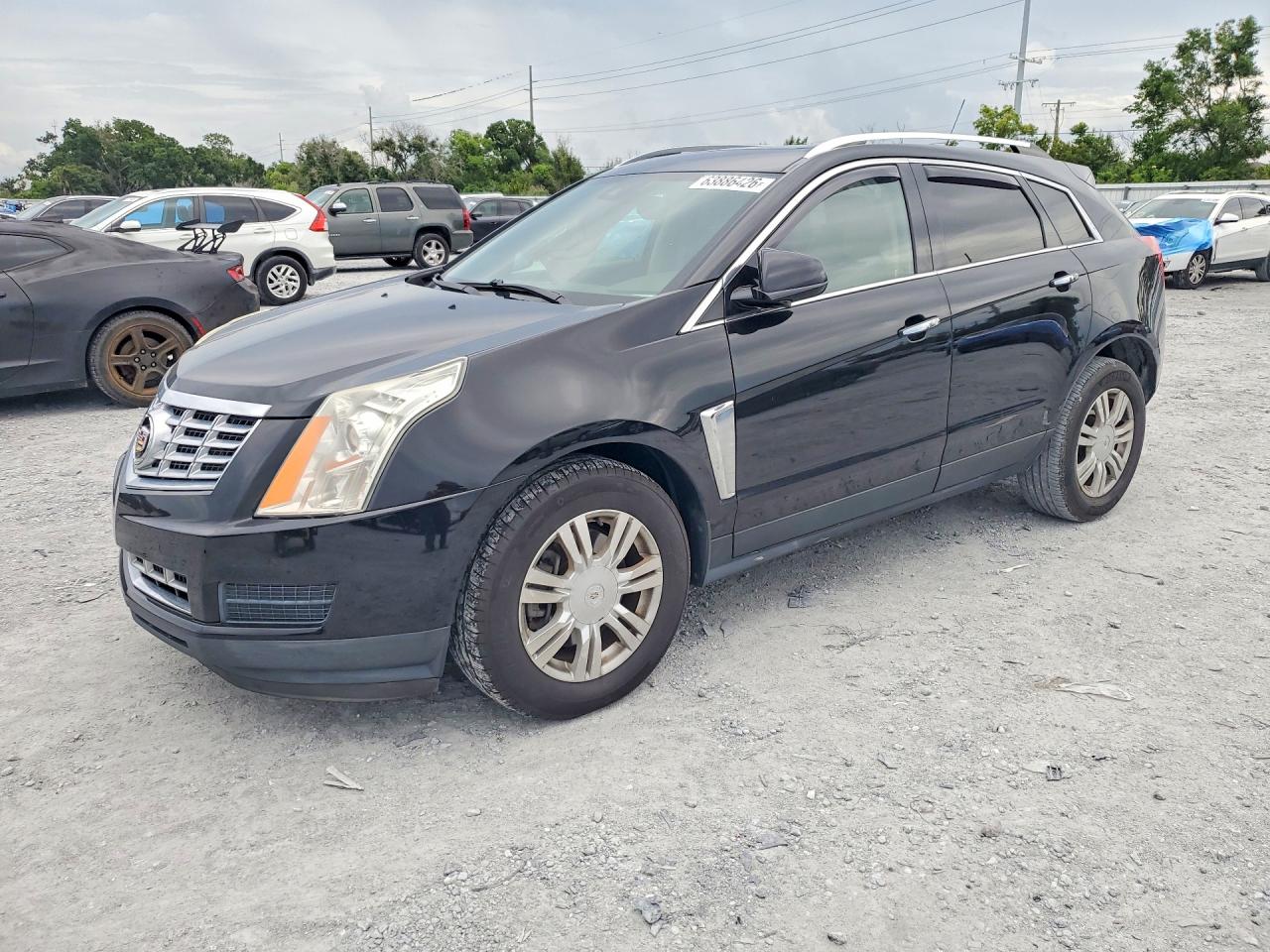 2016 Cadillac SRX Luxury Collection, VIN 3GYFNBE30GS586299 — Side