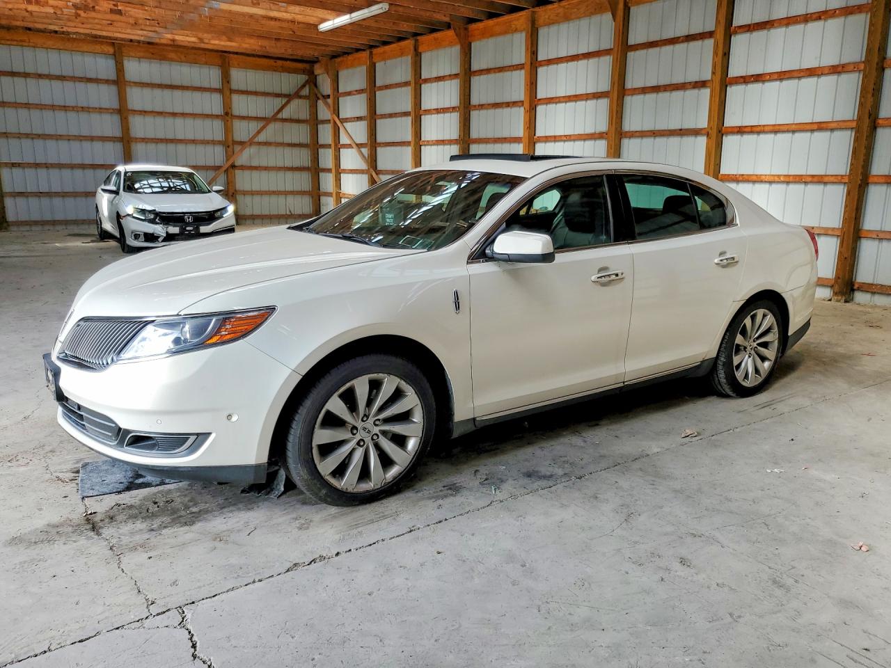 2013 Lincoln MKS, VIN 1LNHL9EK1DG615299 — Normal wear