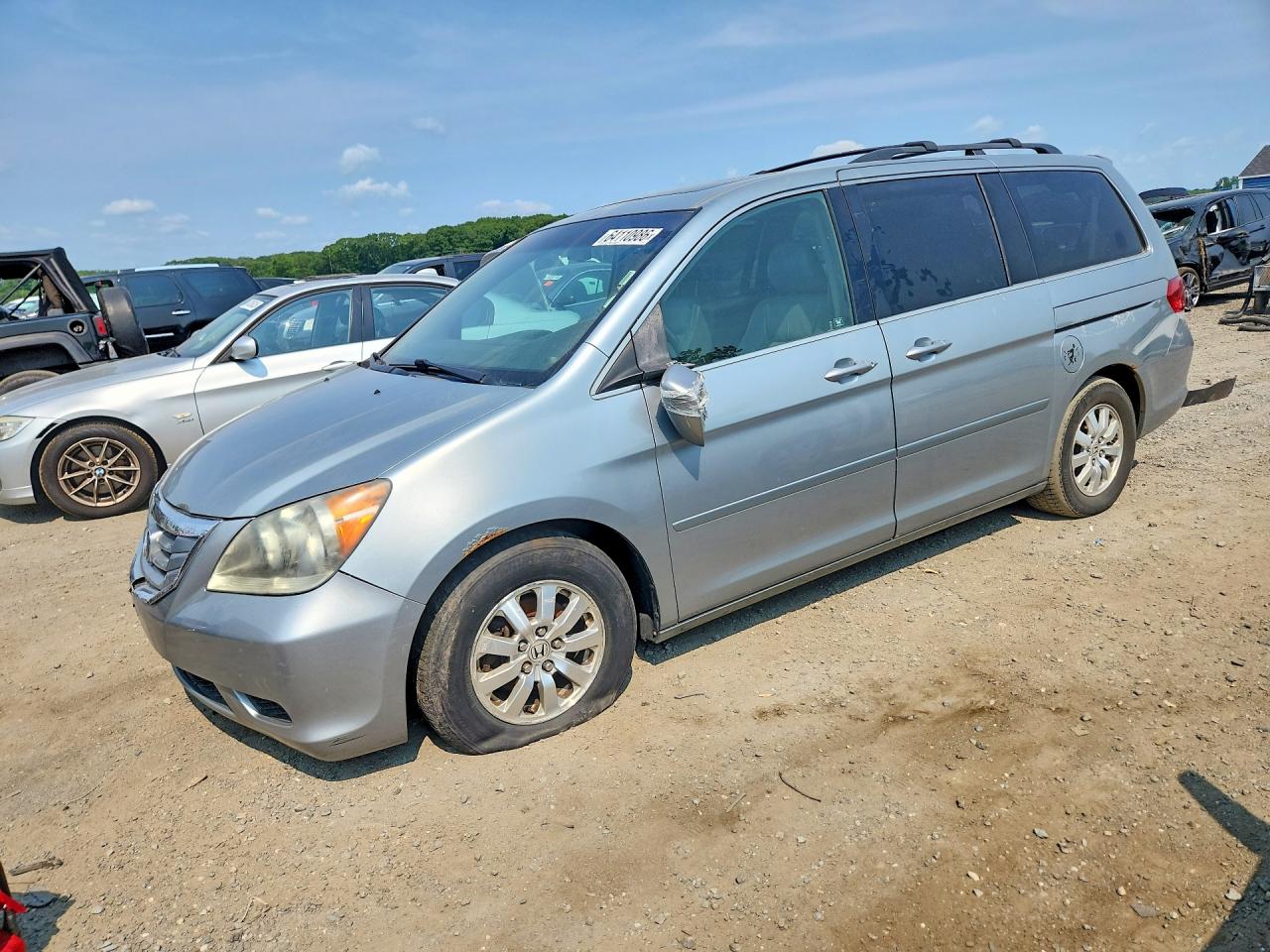 2010 Honda Odyssey EX-L, VIN 5FNRL3H79AB102286 — Front end