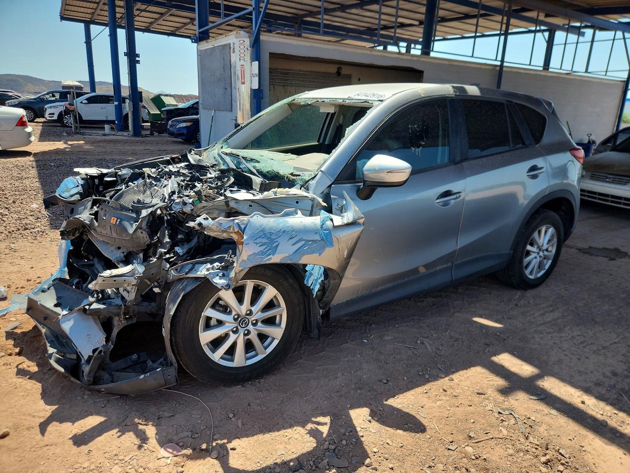 2015 Mazda CX-5 Touring, VIN JM3KE2CY8F0533026 — Front end