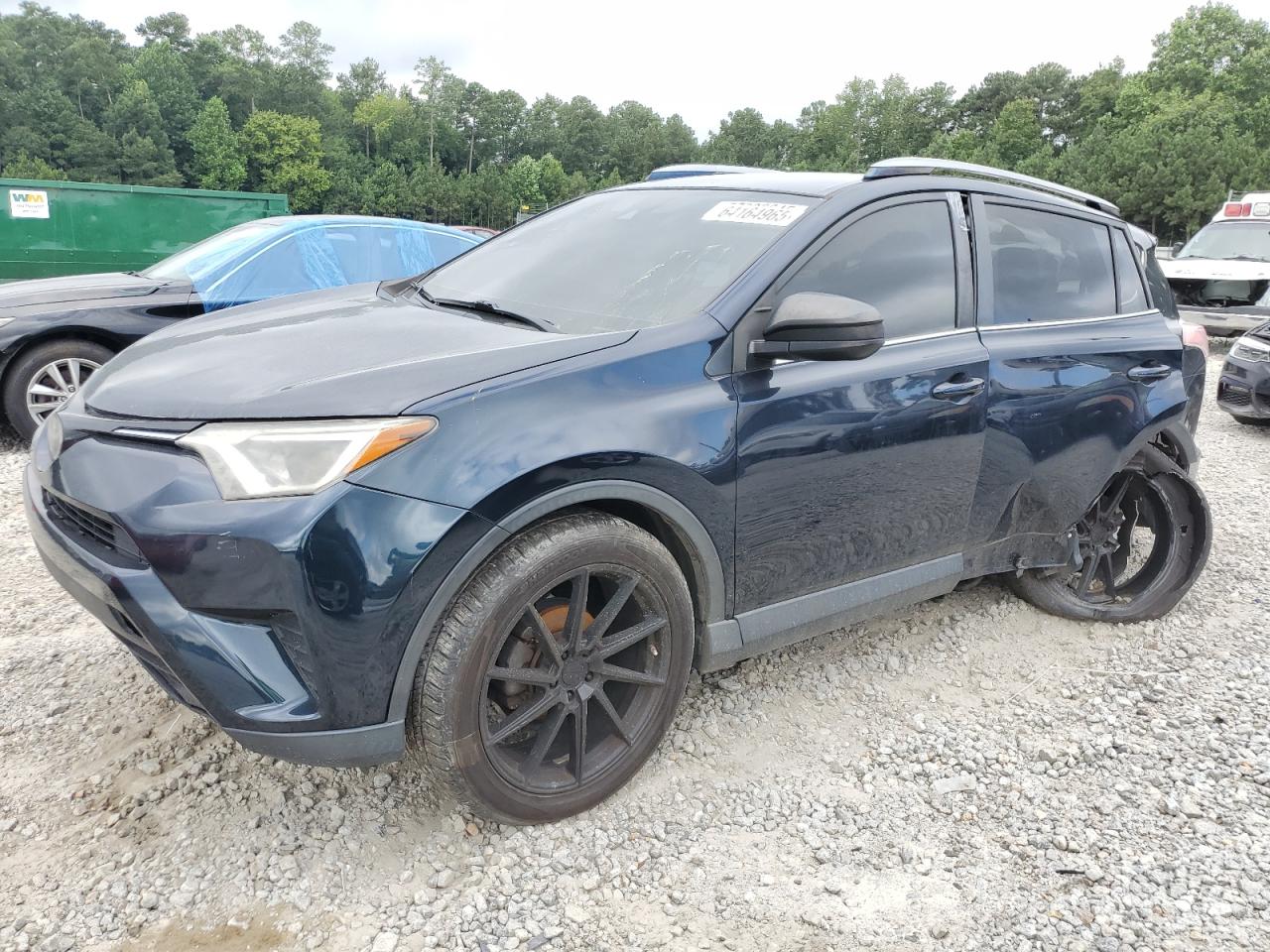2017 Toyota RAV4 LE, VIN JTMZFREV5HJ128786 — Side