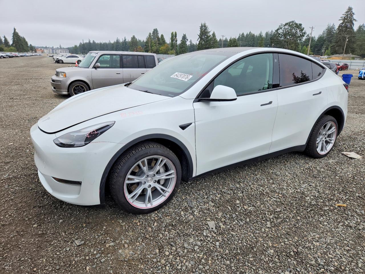 2023 Tesla Model Y Long Range, VIN 7SAYGDEE2PF617456 — Auction photo 1 of 12