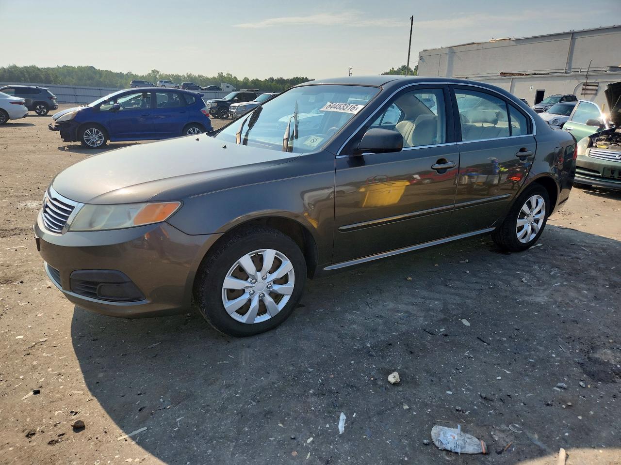 2009 Kia Optima LX, VIN KNAGE228695363933 — Мелкие вмятины и царапины