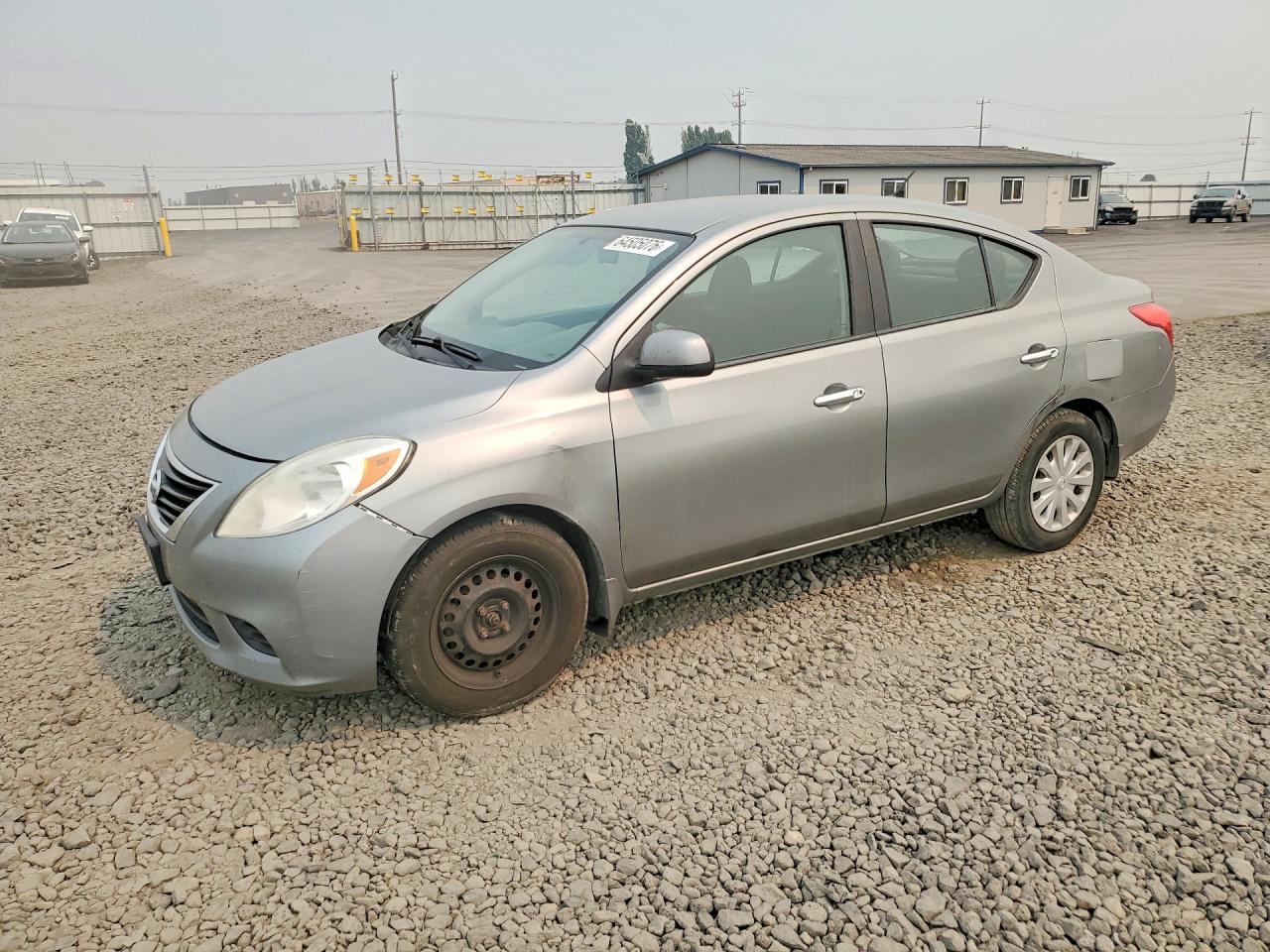 2012 Nissan Versa S, VIN 3N1CN7AP9CL928841 — Side