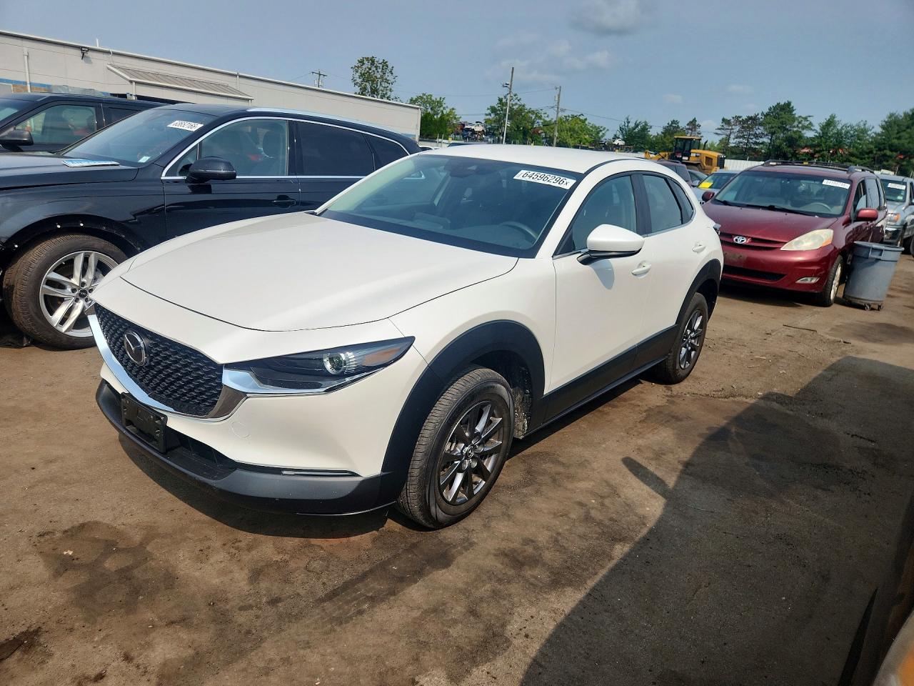 2023 Mazda CX-30 S, VIN 3MVDMBAM6PM511480 — Hail