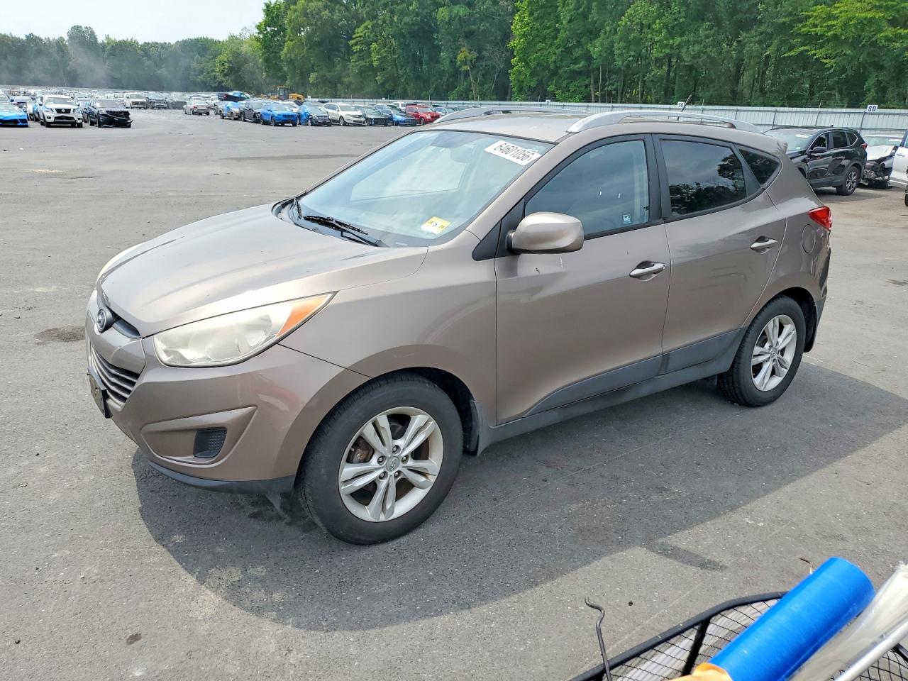 2011 Hyundai Tucson Limited, VIN KM8JU3ACXBU289706 — Front end