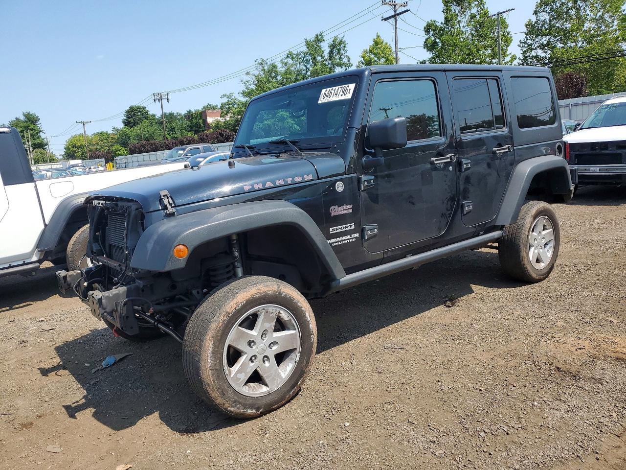 2015 Jeep Wrangler Unlimited Sport, VIN 1C4BJWDG5FL663247 — Бок