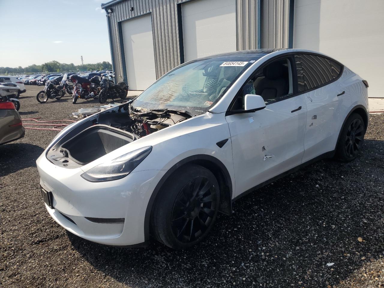 2023 Tesla Model Y Long Range, VIN 7SAYGAEE1PF665979 — Engine fire