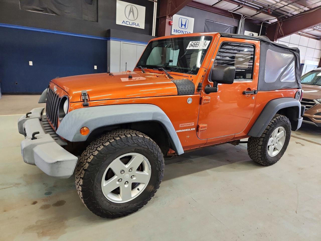 2011 Jeep Wrangler Sport, VIN 1J4AA2D18BL569142 — Minor dents and scratches
