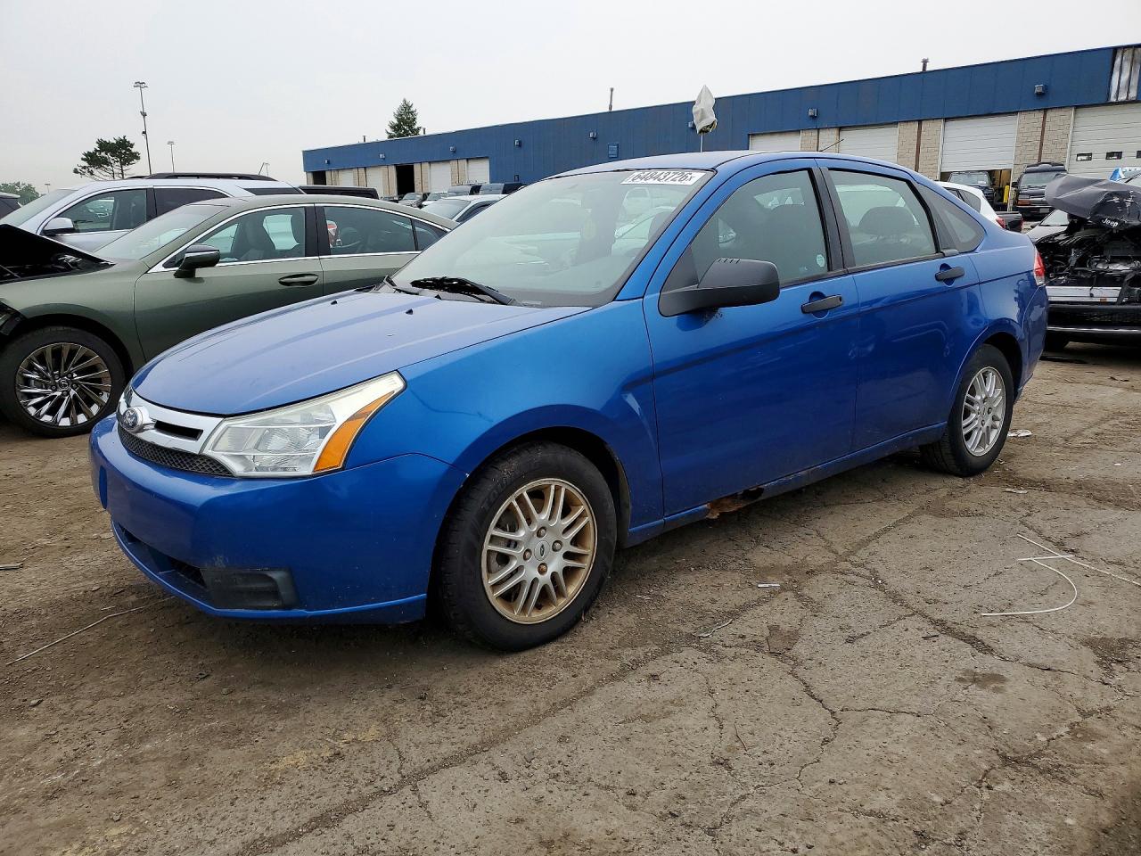 2011 Ford Focus SE, VIN 1FAHP3FN6BW146072 — Side